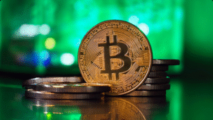 Shiny gold Bitcoin coin representing crypto prop trading and the growing influence of digital assets in proprietary trading firms.