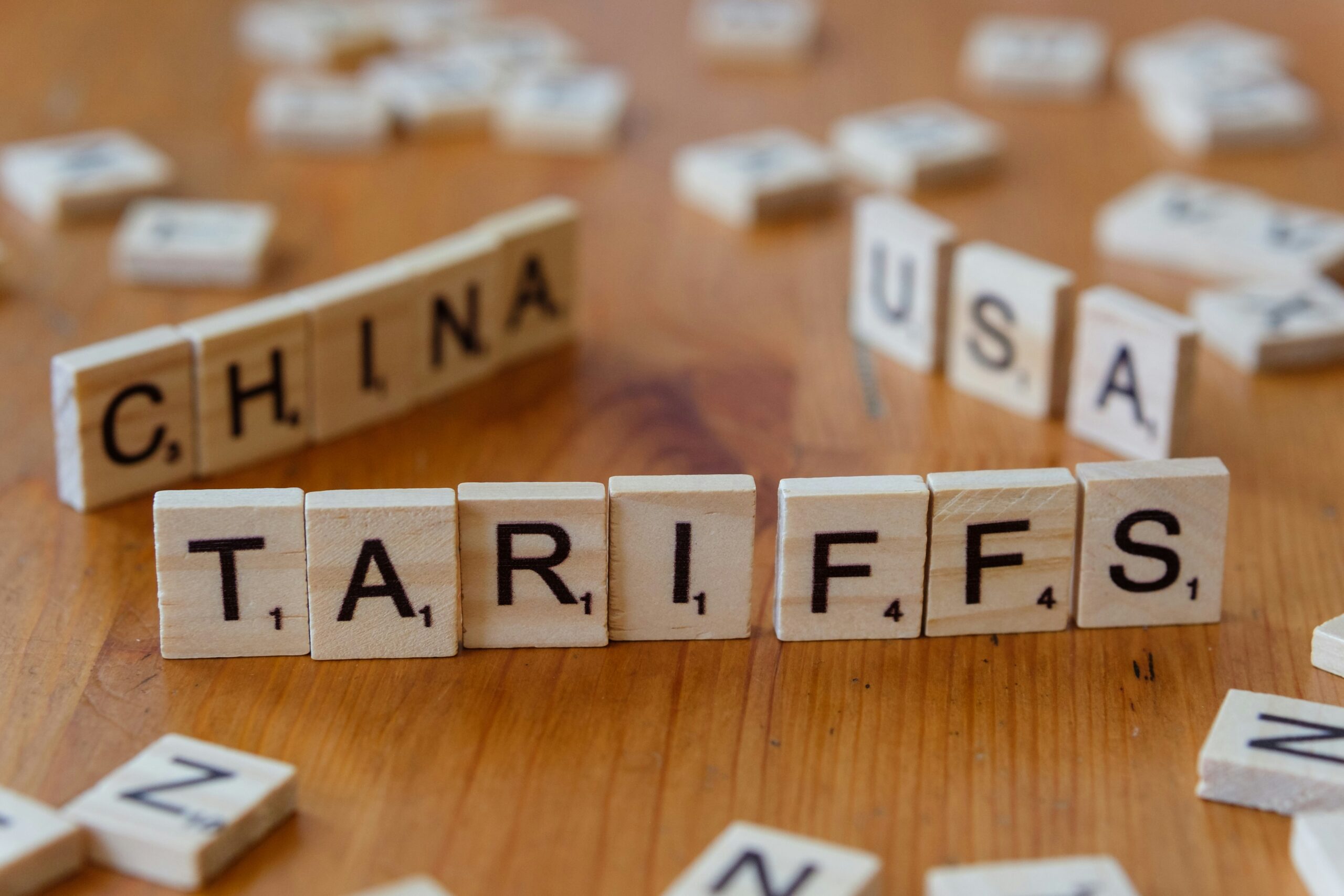 Proprietary traders analyzing market data on multiple screens amid tariff and inflation concerns